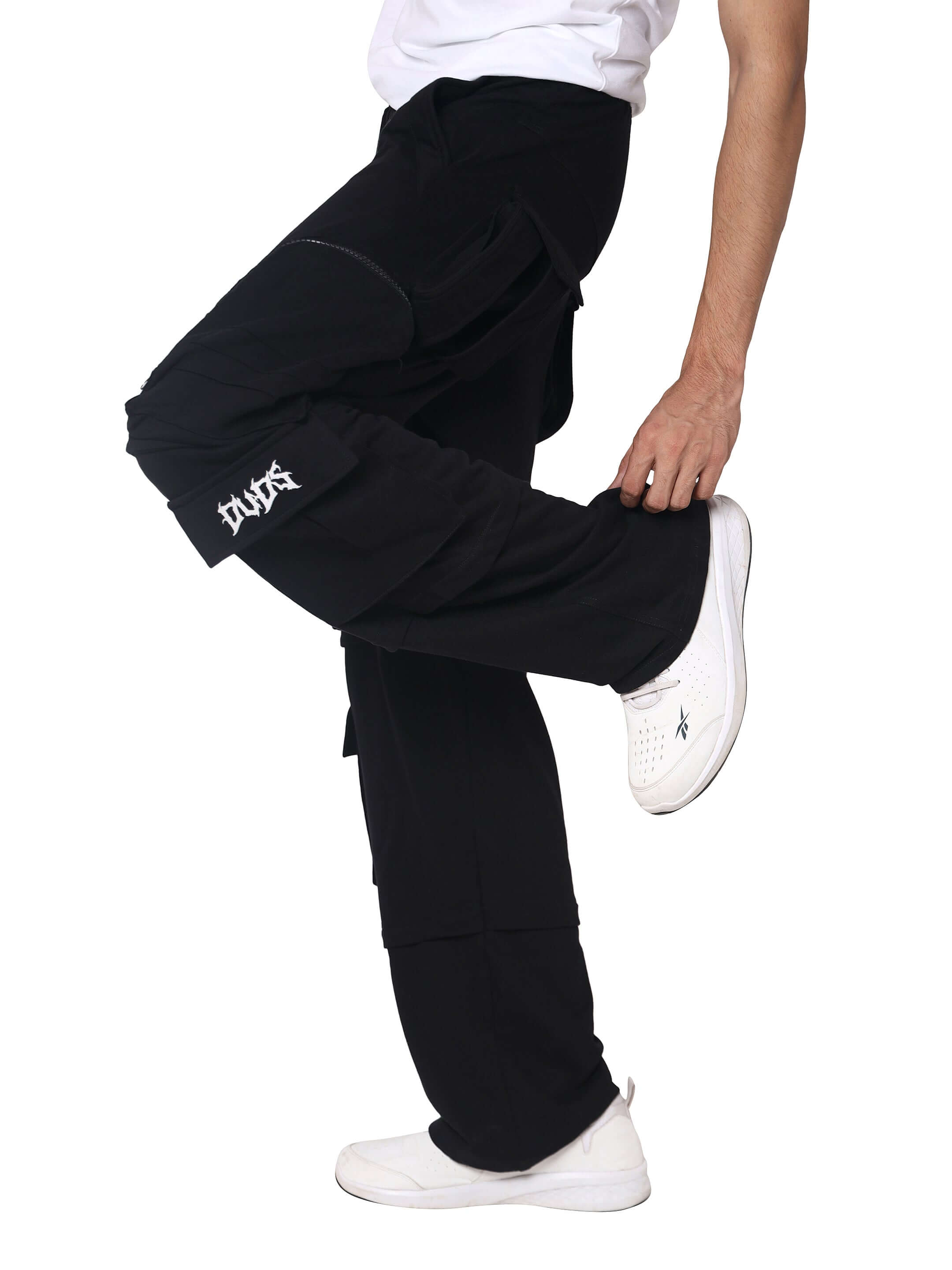 Model wearing black women's 8 pocket cargo pant with zipper patch pocket from DUDS