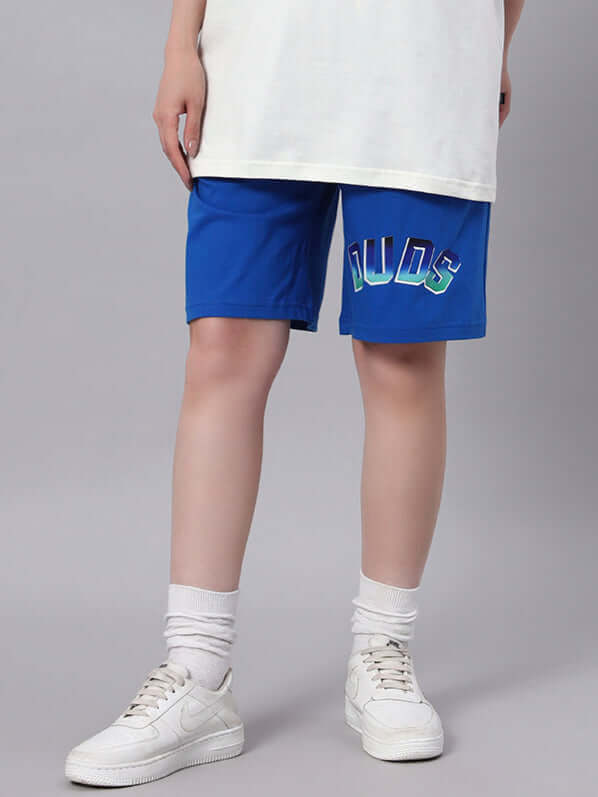 WOMENS BUNNY BUGS SUMMER SHORTS BLUE worn with white sneakers, featuring playful graphics, perfect for a cute, comfortable summer look.