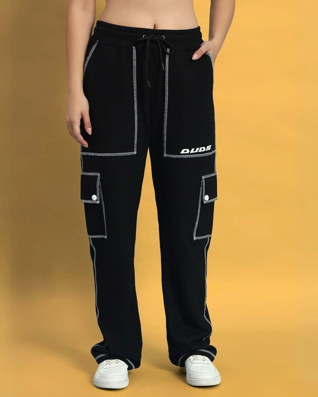 Women's black dynamic 5 pocket cargo pants by DUDS, featuring a relaxed fit with white stitching, ideal for casual wear.