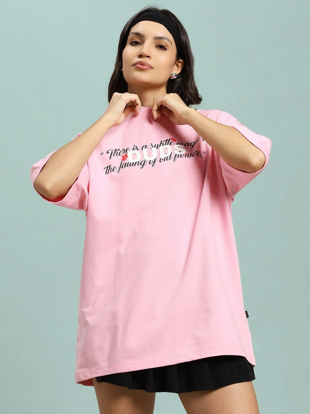 Model wearing pink Women's Falling Flower T-Shirt made of premium cotton French terry, emphasizing comfort and style.