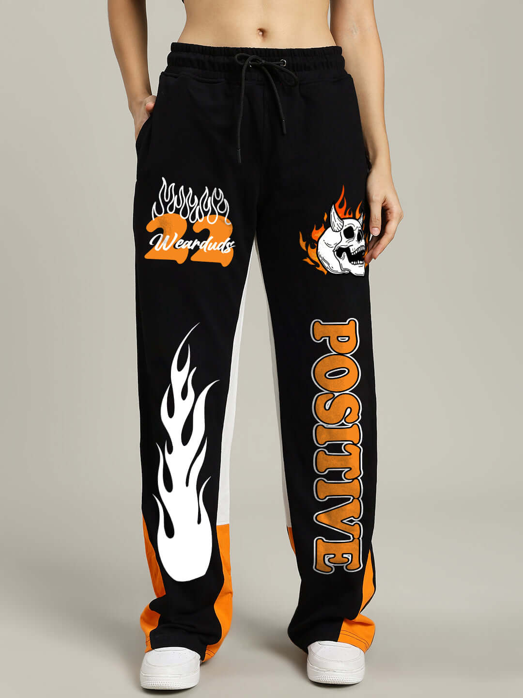 Women's Fearless Contrast Relaxed Fit Joggers in Black and Orange, featuring bold graphics and a comfortable design, made by DUDS tailors.