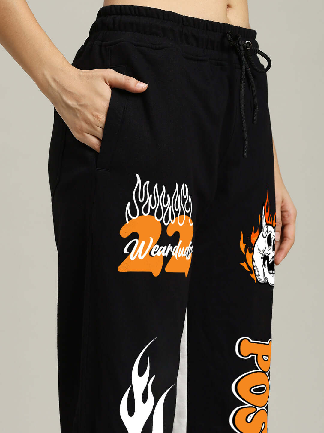 WOMENS FEARLESS CONTRAST RELAXED FIT JOGGERS BLACK-ORANGE with orange side detailing, premium cotton blend, bold streetwear style.