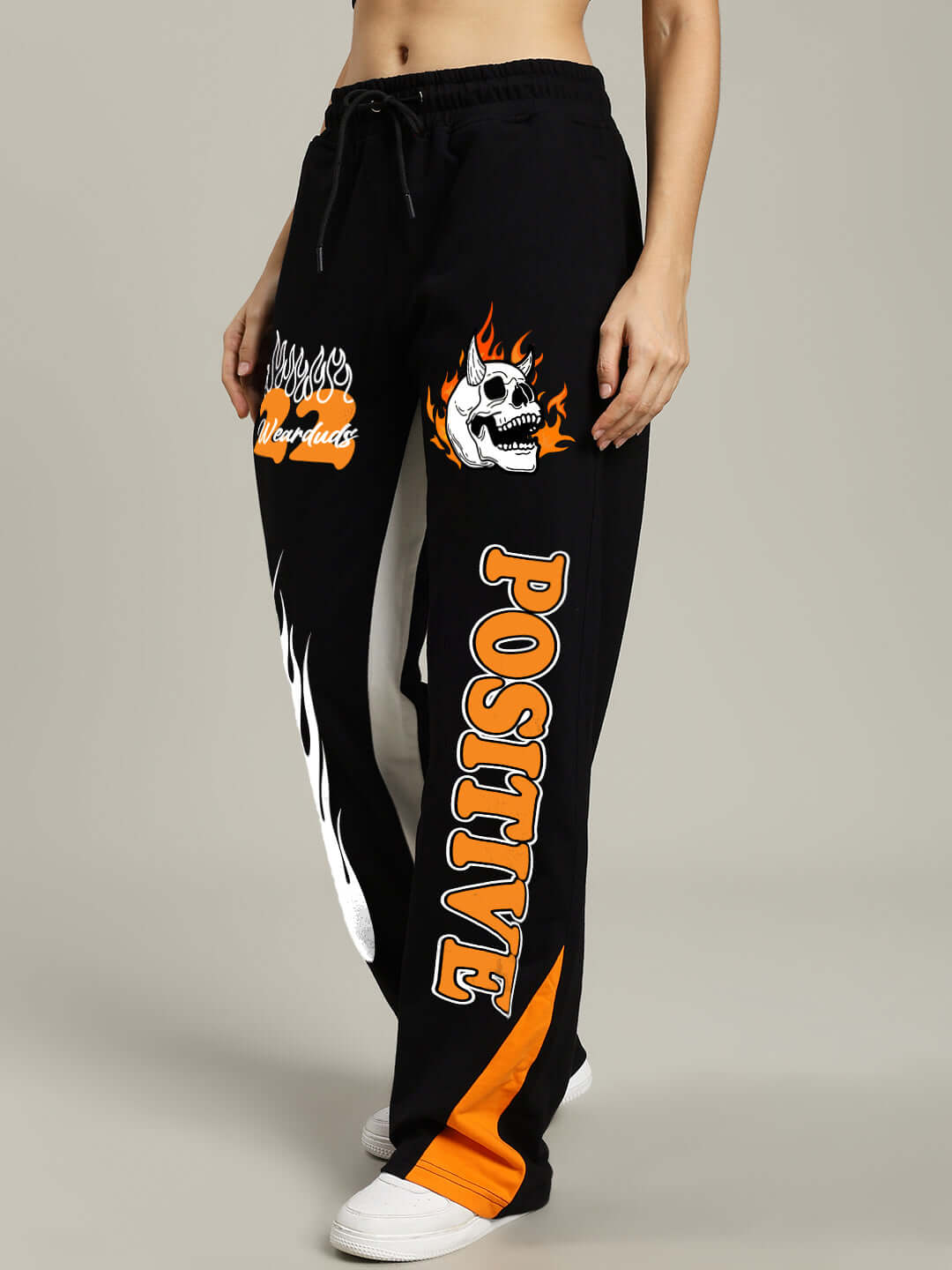 WOMENS FEARLESS CONTRAST RELAXED FIT JOGGERS BLACK-ORANGE with bold orange side detailing and graphic prints for a sporty streetwear look.