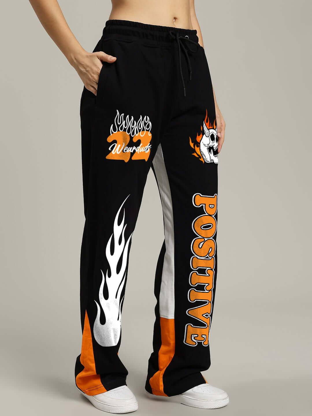 WOMENS FEARLESS CONTRAST RELAXED FIT JOGGERS BLACK-ORANGE with bold graphic and orange side detailing.