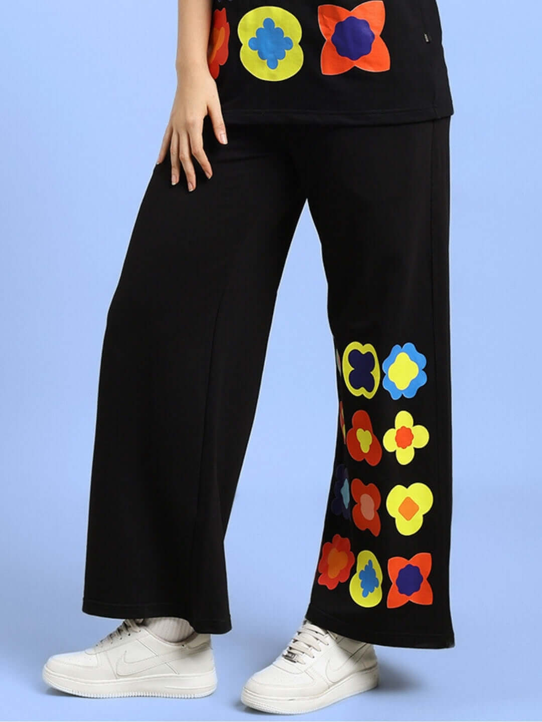 Alt Tag: WOMEN'S HOLLISTER JOGGERS BLACK with colorful patterns, tailored fit, customizable size option, worn with white sneakers