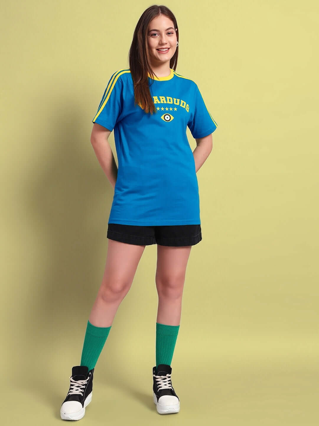 Woman wearing a Women's Irish Regular Fit Blue T-shirt made of 100% cotton, showcasing casual style.