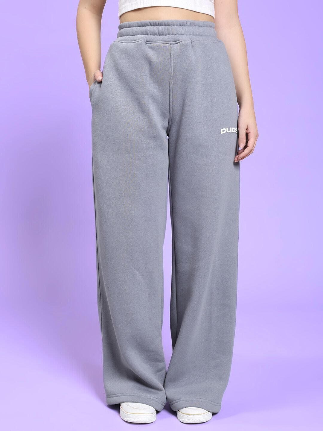WOMEN'S MAKE IT HAPPEN COTTON FLEECE JOGGER GREY with elastic waistband shown on model against purple background.
