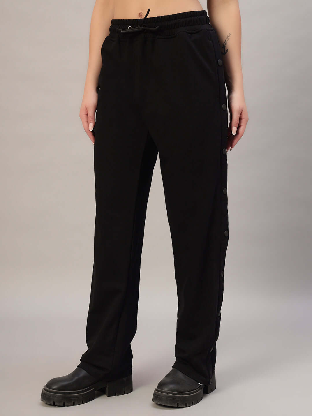 Alt Tag: Women's Mambo Joggers in black, featuring a stylish design with button accents, perfect for casual wear.