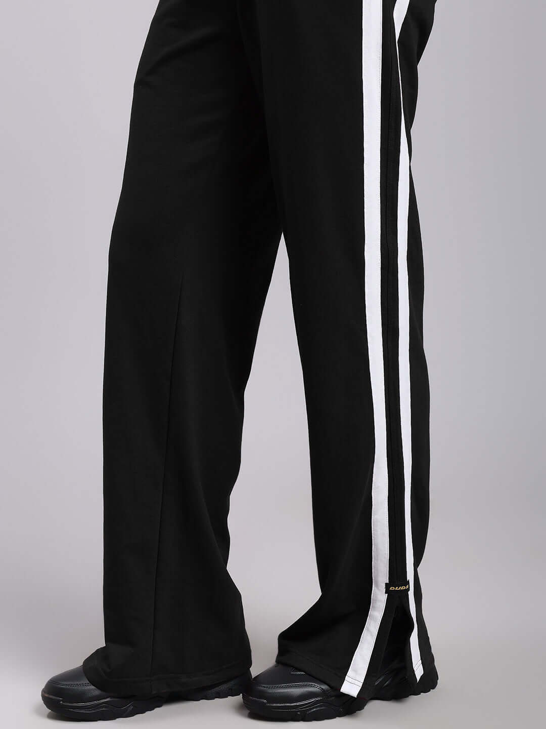 Women's Moscow relaxed fit joggers in black with white side stripes, made-to-order by DUDS, featuring customizable size option.