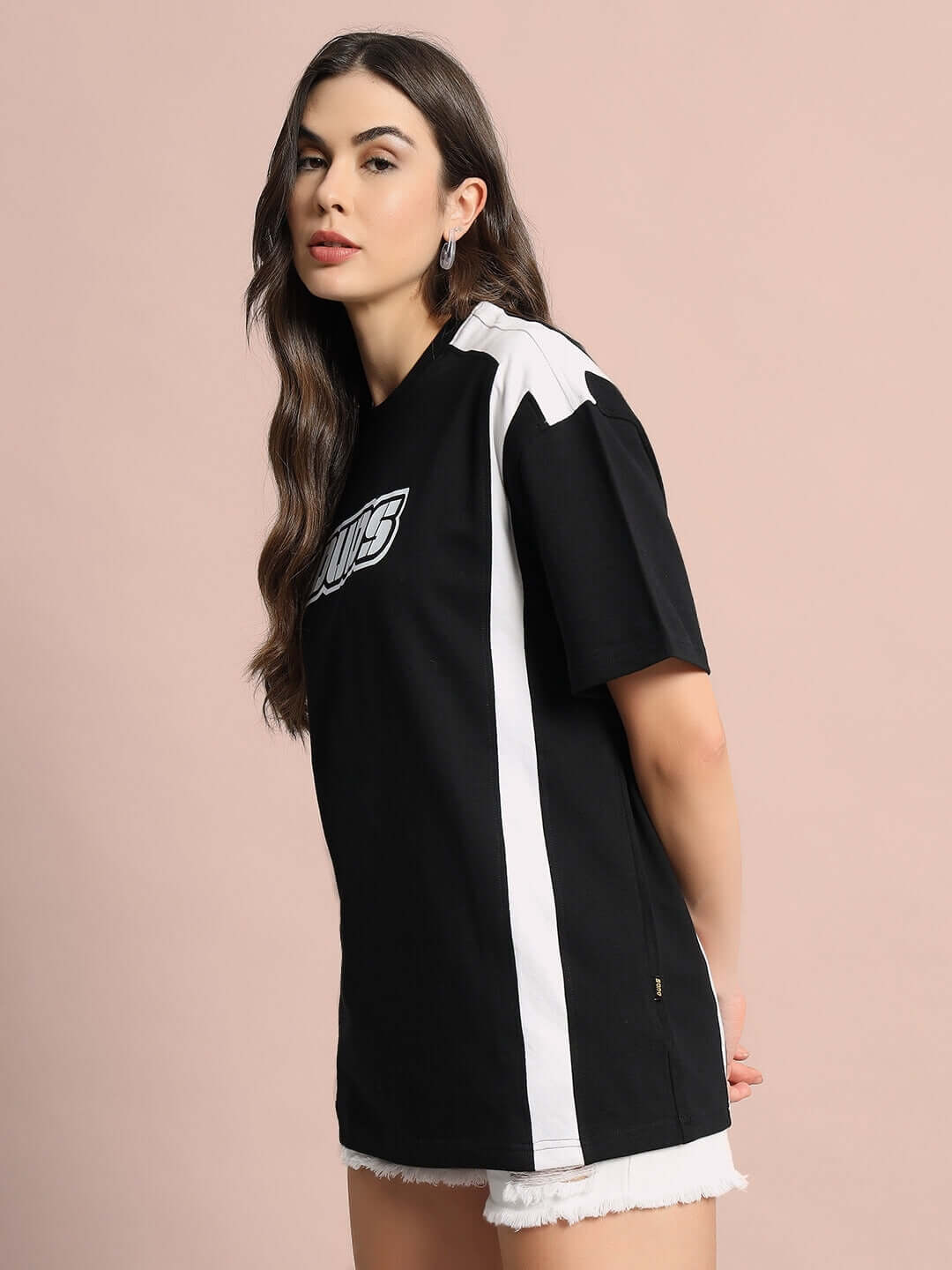 Model wearing Women's Ninja Storm Over-Sized T-Shirt in black, premium cotton and elastane blend, featuring logo and side stripes.