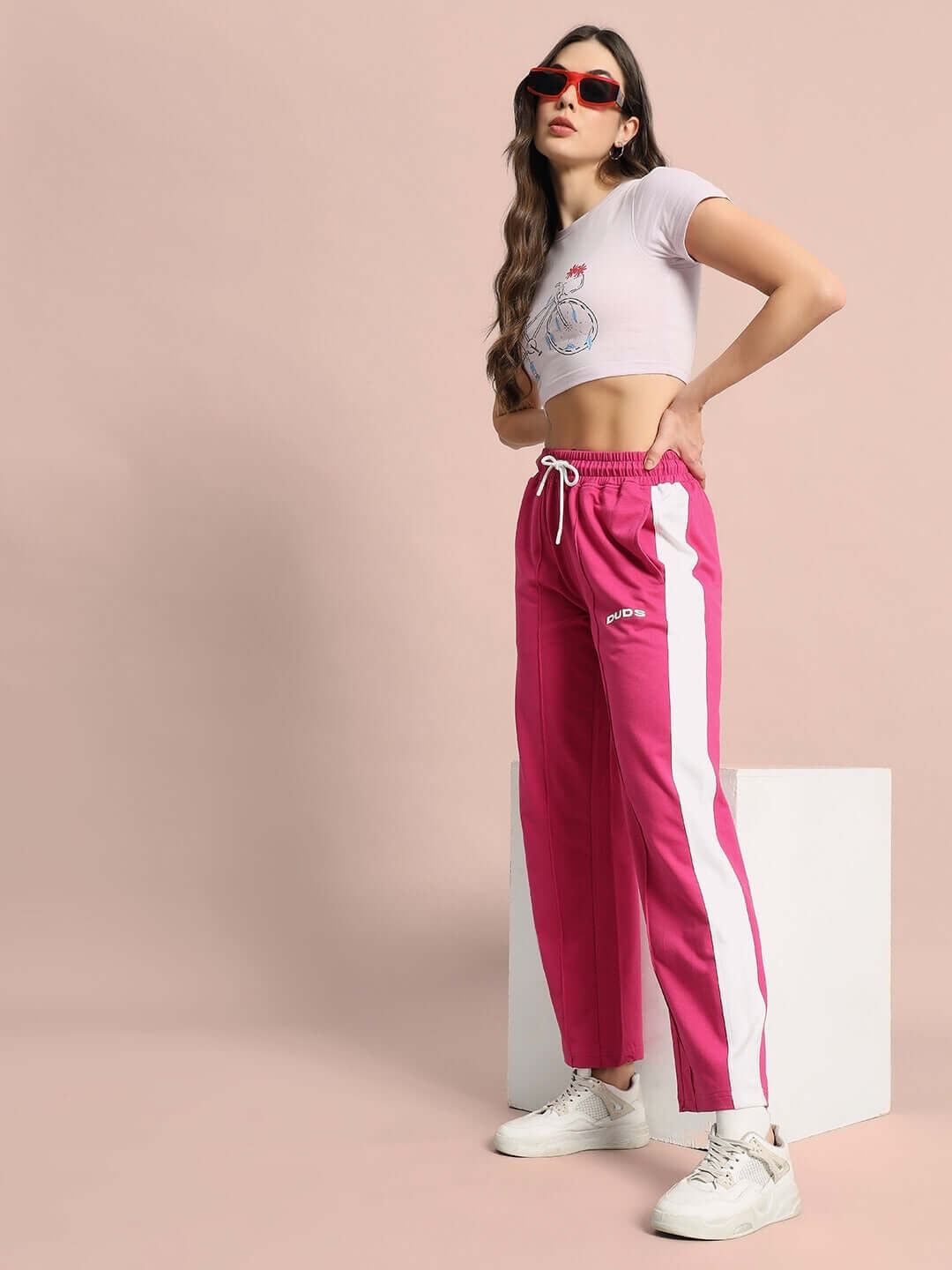 Women's pink side seam plated joggers styled for custom fit options, showcasing comfort and trendy design by DUDS.