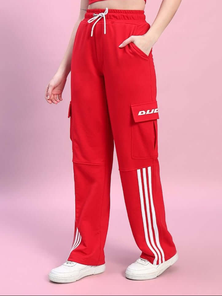 Women's Redroit red joggers with relaxed fit, featuring five pockets and stripe details, made to order by experienced tailors of DUDS.