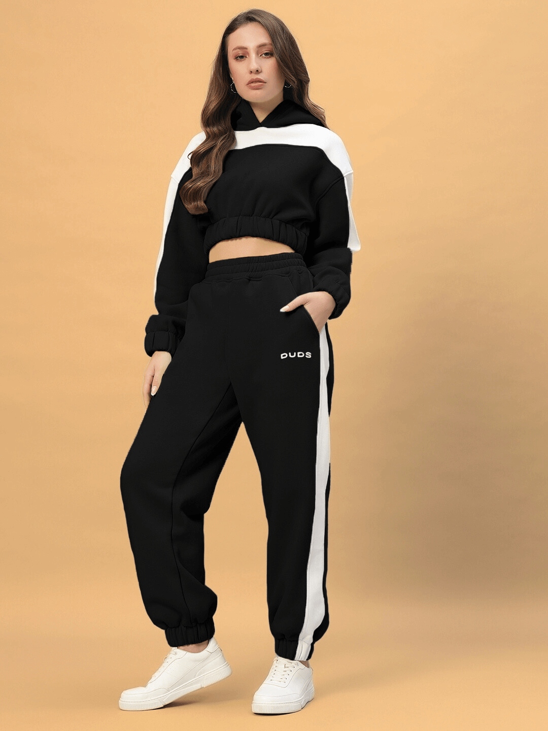 Woman wearing DUDS Women's Rizzler Colorblock Co-ord in Black, featuring a stylish hoodie and joggers set.