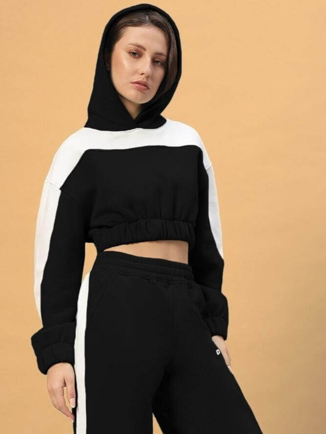 Model wearing WOMEN RIZZLER OVERSIZED CROP HOODIES BLACK, showcasing the trendy design with a modern, oversized cropped fit.