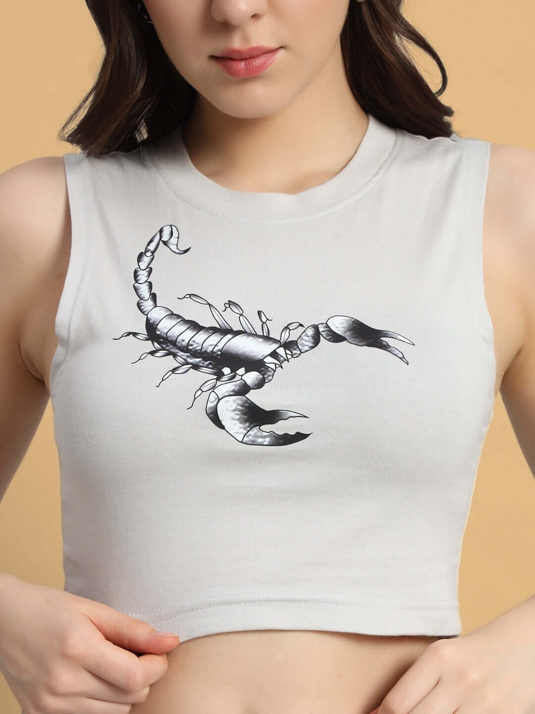 Woman wearing grey Scorpius Co-ord set top with scorpion print, made from premium cotton French Terry fabric.