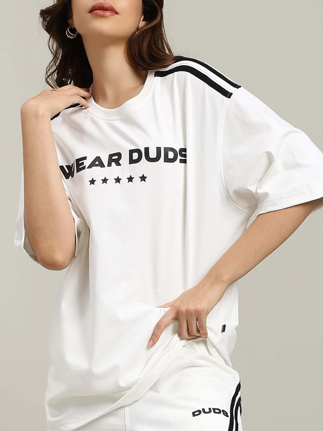 Model wearing WOMEN'S STAR JUMPER SUMMER CO-ORD SET OFF WHITE made from premium cotton terry lycra, featuring stylish design and comfort.