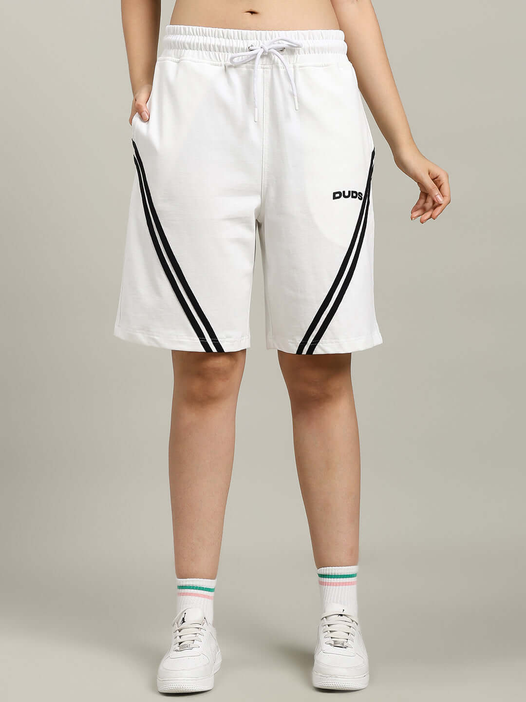 Model wearing WOMEN'S STAR JUMPER SUMMER CO-ORD SET OFF WHITE, featuring premium cotton fabric, with black stripe design and elastic waistband.