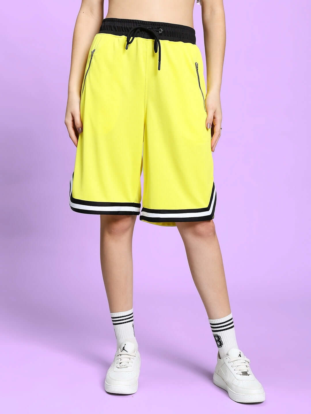 Model wearing WOMEN'S VIGOR COLORBLOCK CO-ORD SET YELLOW with shorts and sneakers
