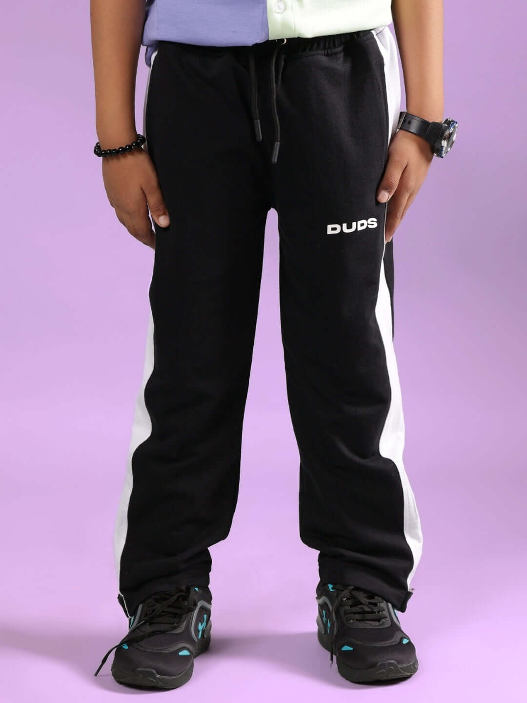 Black jogger pants for boys and girls by DUDS, featuring a stylish design. Perfect for everyday wear, made-to-order with custom fit options.