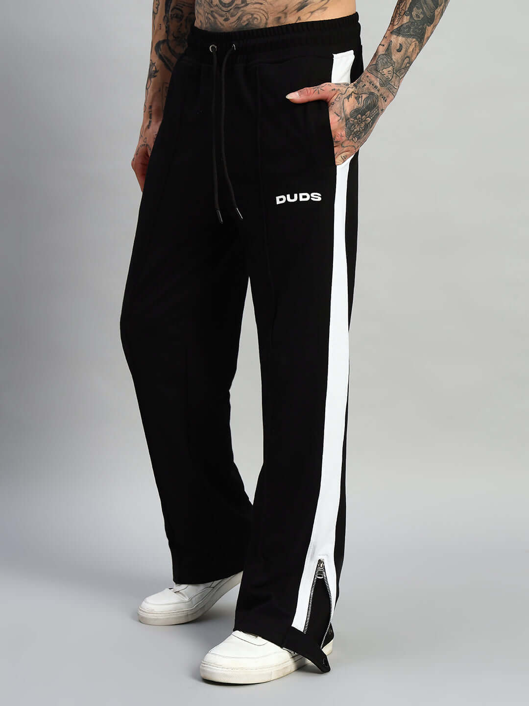 Black and white Wonder Slit Zipper Joggers by DUDS with custom fit option, featuring side zippers and made-to-order craftsmanship.