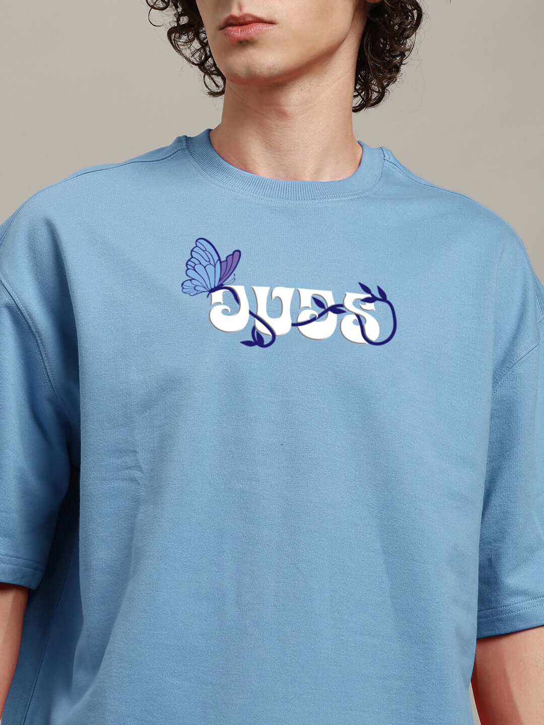 Light blue t-shirt with unique printed design, made from premium cotton French terry fabric, featuring a butterfly motif. Made in India.