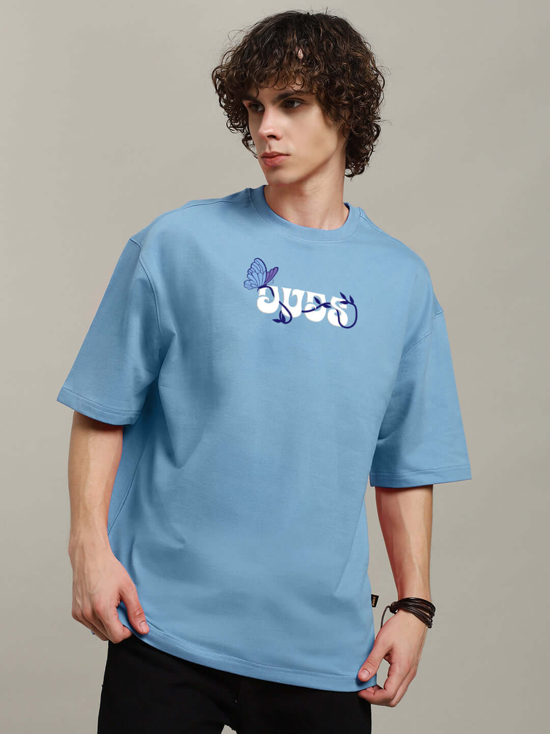 Model wearing light blue 'Your Feeling' printed t-shirt, made from premium cotton fabric. Bio-washed for softness. Manufactured in India.
