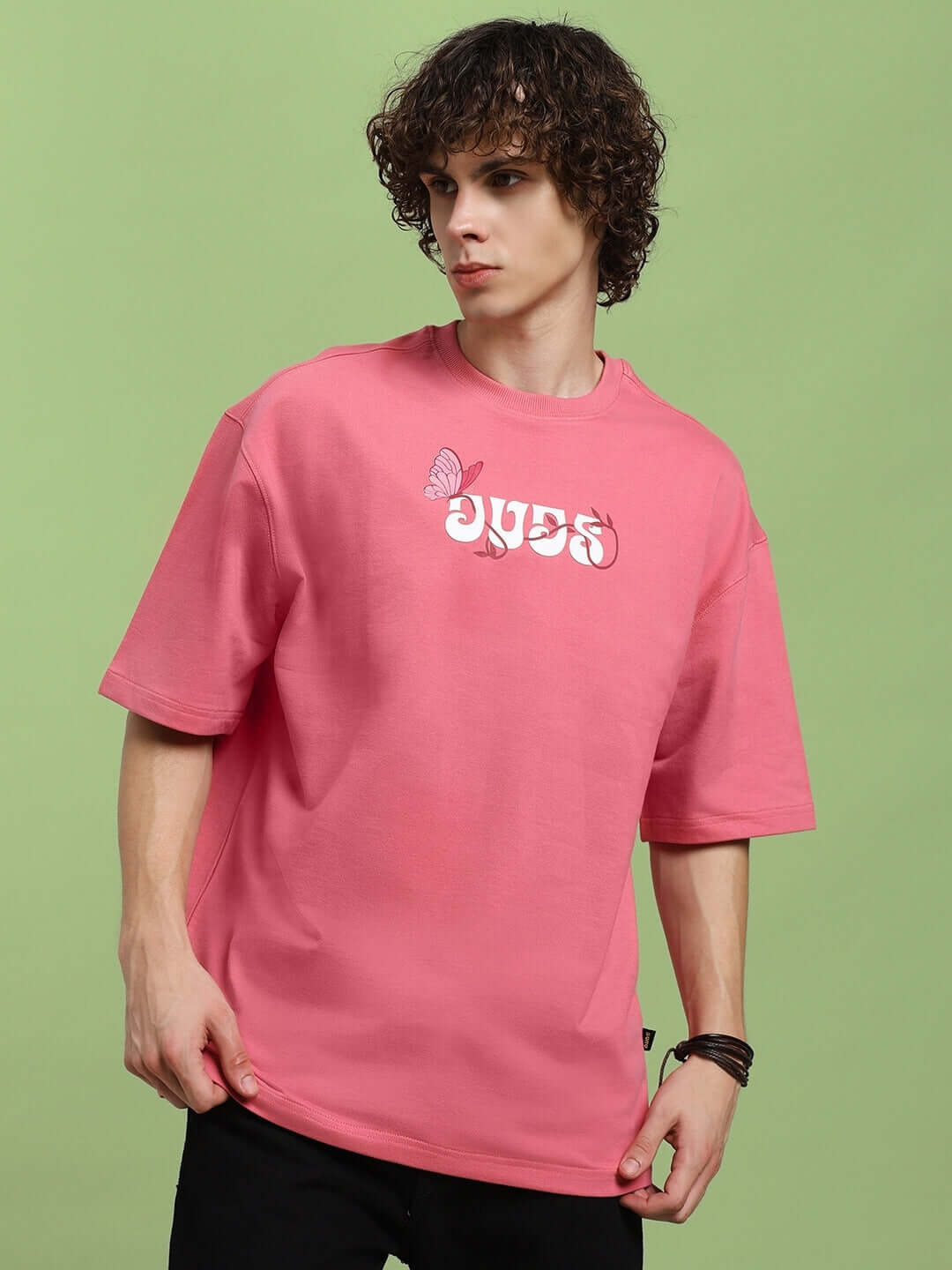 Model wearing YOUR FEELING PRINTED T-SHIRT in pink, made from premium cotton, showcasing text design. Ideal for casual wear.
