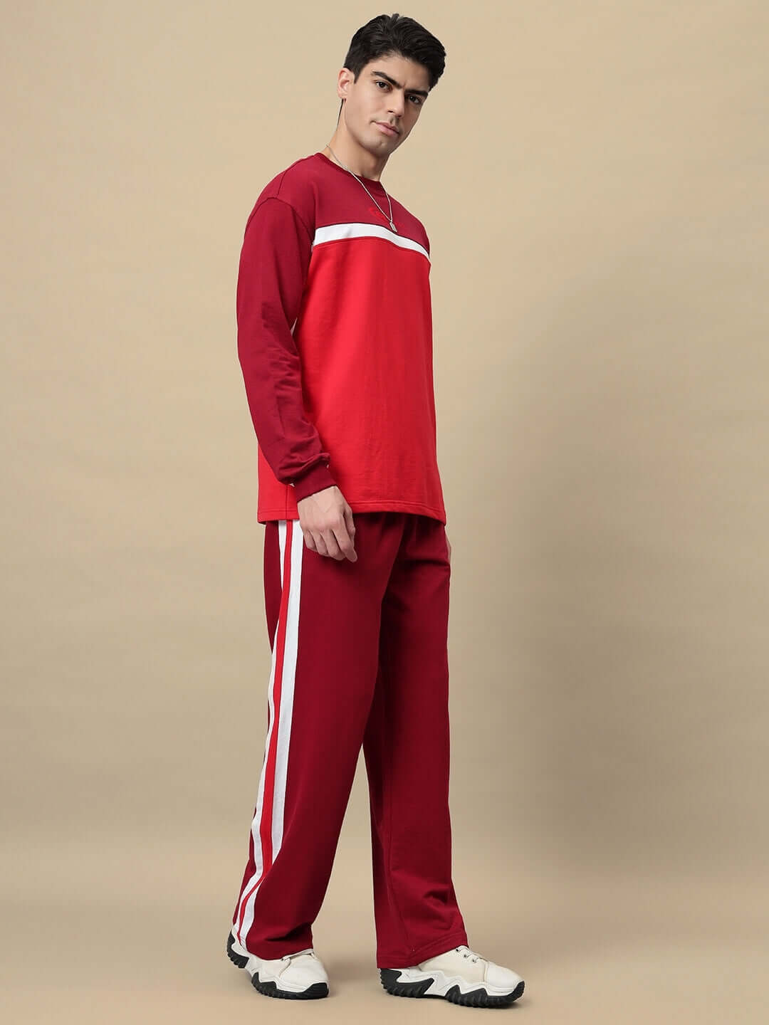 Model wearing ZEST OVERSIZED CO-ORD SET MAROON with relaxed sweatshirt and joggers, showcasing a stylish streetwear look.