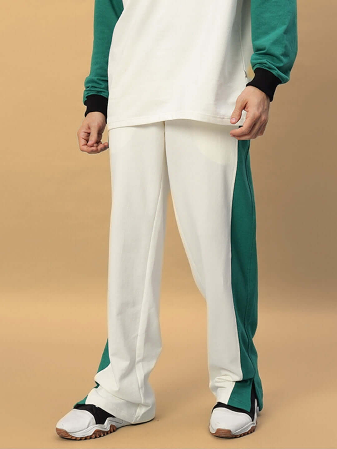 Zingy Jogger in Off White and Teal worn on model, showcasing stylish design with custom fit option, made by DUDS.