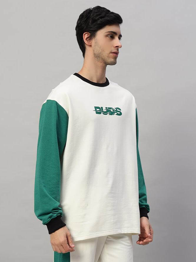 ZINGY oversized sweatshirt in off-white and teal with 'BUZZ' text, features premium cotton French terry, 240 GSM, worn by a model.