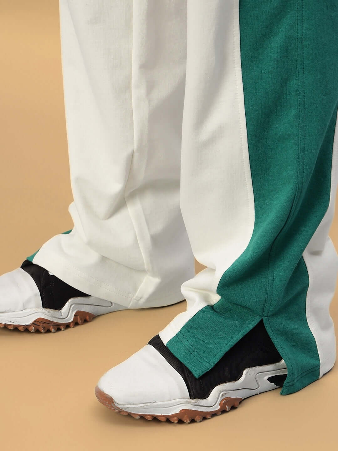 ZINGY JOGGER in off white and teal, featuring a split hem design, tailored with precision. Ideal for custom fit orders. DUDS craftsmanship.