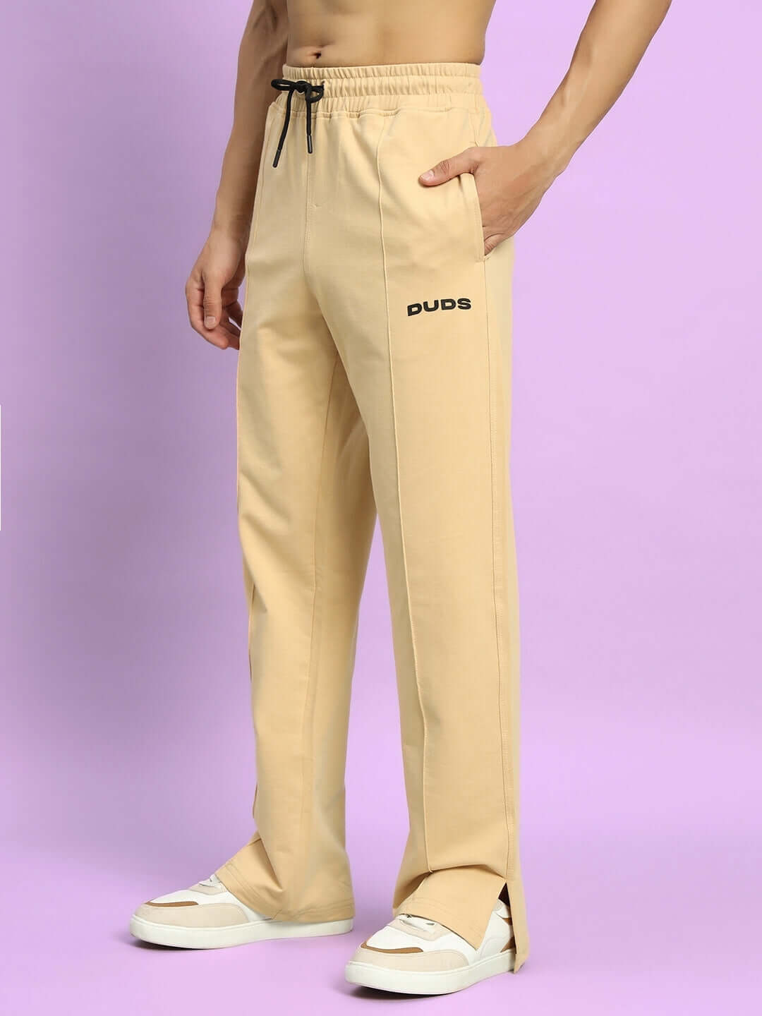 Beige Zion Side Slit Joggers by DUDS displayed on model, featuring customizable options for perfect fit, available for dispatch in 7-10 days.