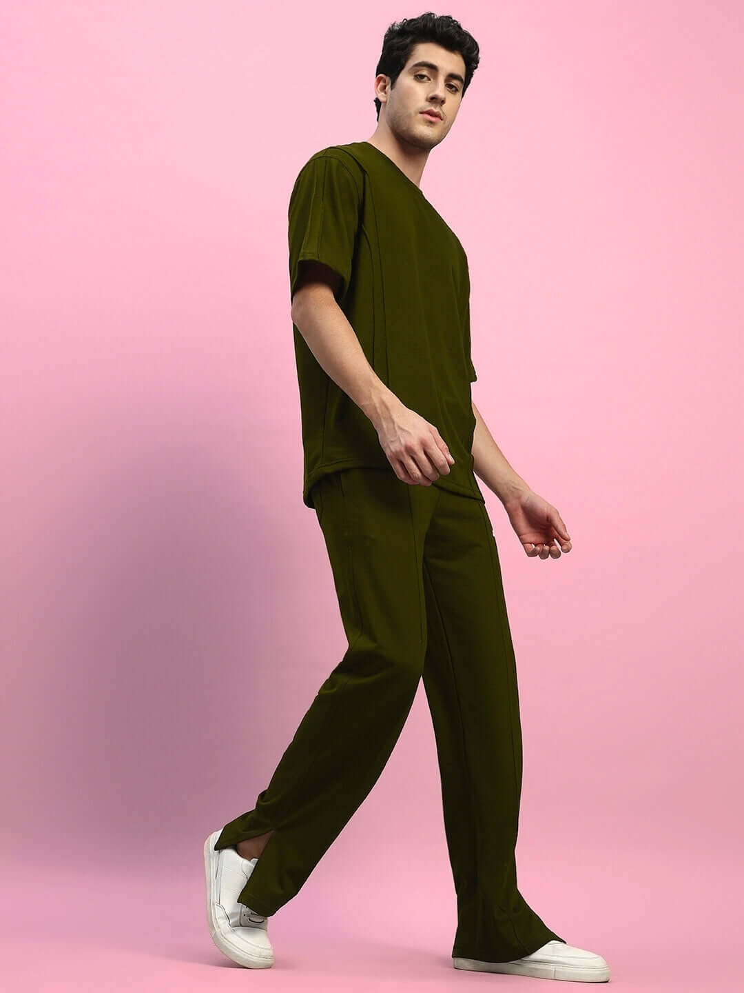 Model wearing ZION olive green co-ord set, featuring relaxed fit joggers and Cotton T-shirt. Unisex style, perfect for comfortable wear.