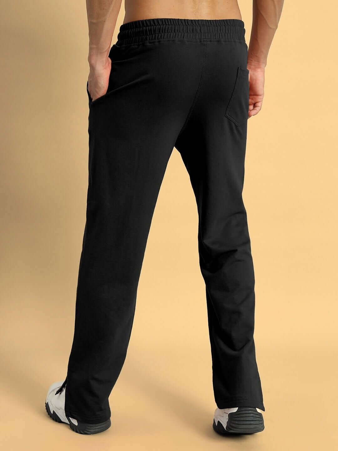 Back view of black ZION SIDE SLIT JOGGERS made to order by DUDS, featuring custom fit option for enhanced comfort and style.