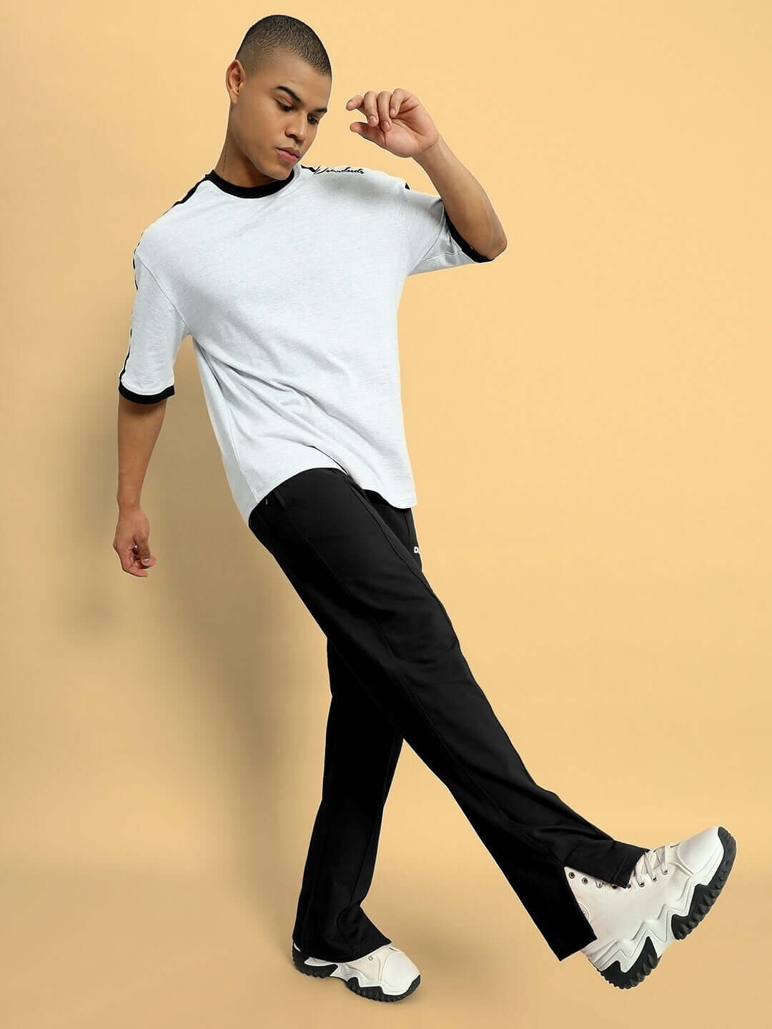 Model wearing Zion Side Slit Joggers in black, showcasing trendy streetwear fashion with custom fit options.