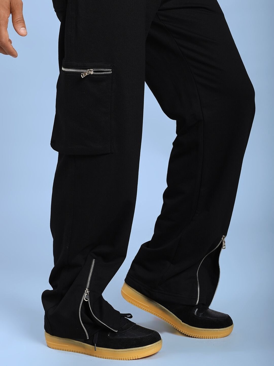 Model wearing ZIP TECH PREMIUM CARGO IN BLACK with zipper details, showing modern style and utility.