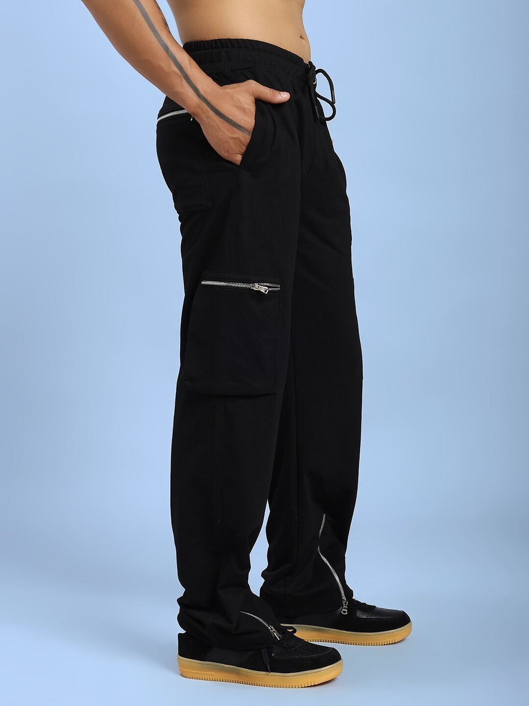 Model wearing ZIP TECH PREMIUM CARGO IN BLACK with tactical pockets and sleek design.