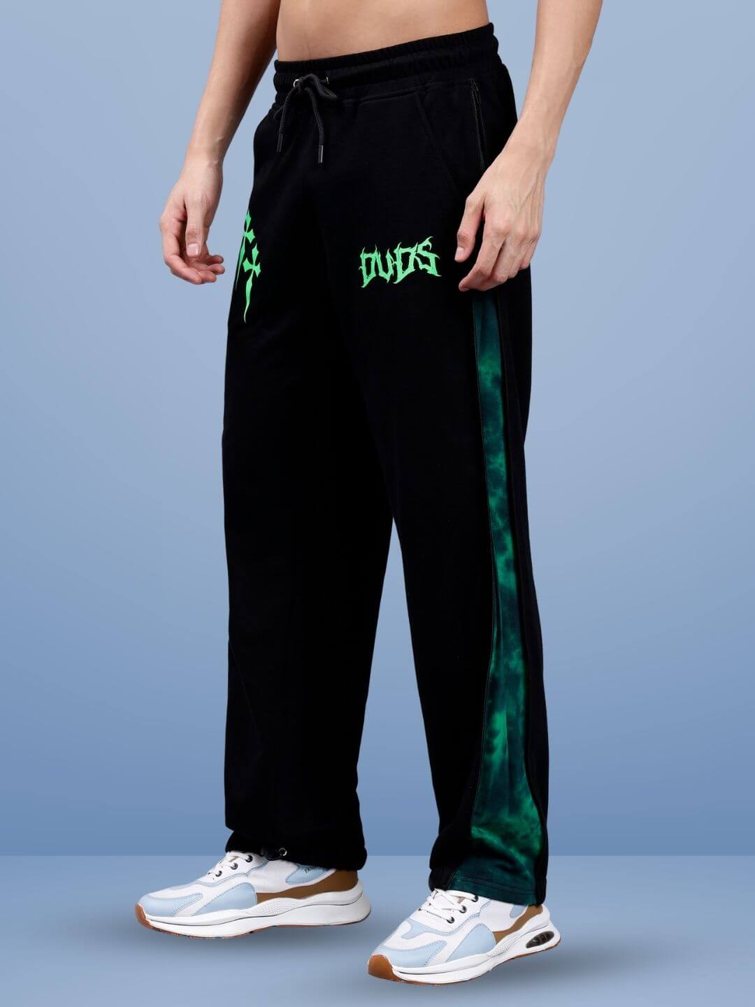 Person wearing green zipper panel joggers by DUDS, made-to-order casual wear.