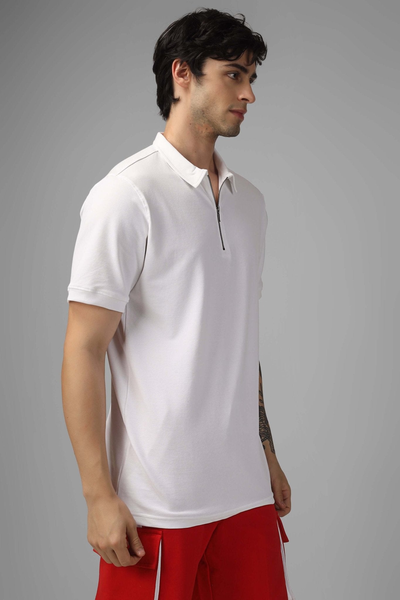 Model wearing ZIPPER POLO NECK COTTON T-SHIRT WHITE with a stylish zipper detail