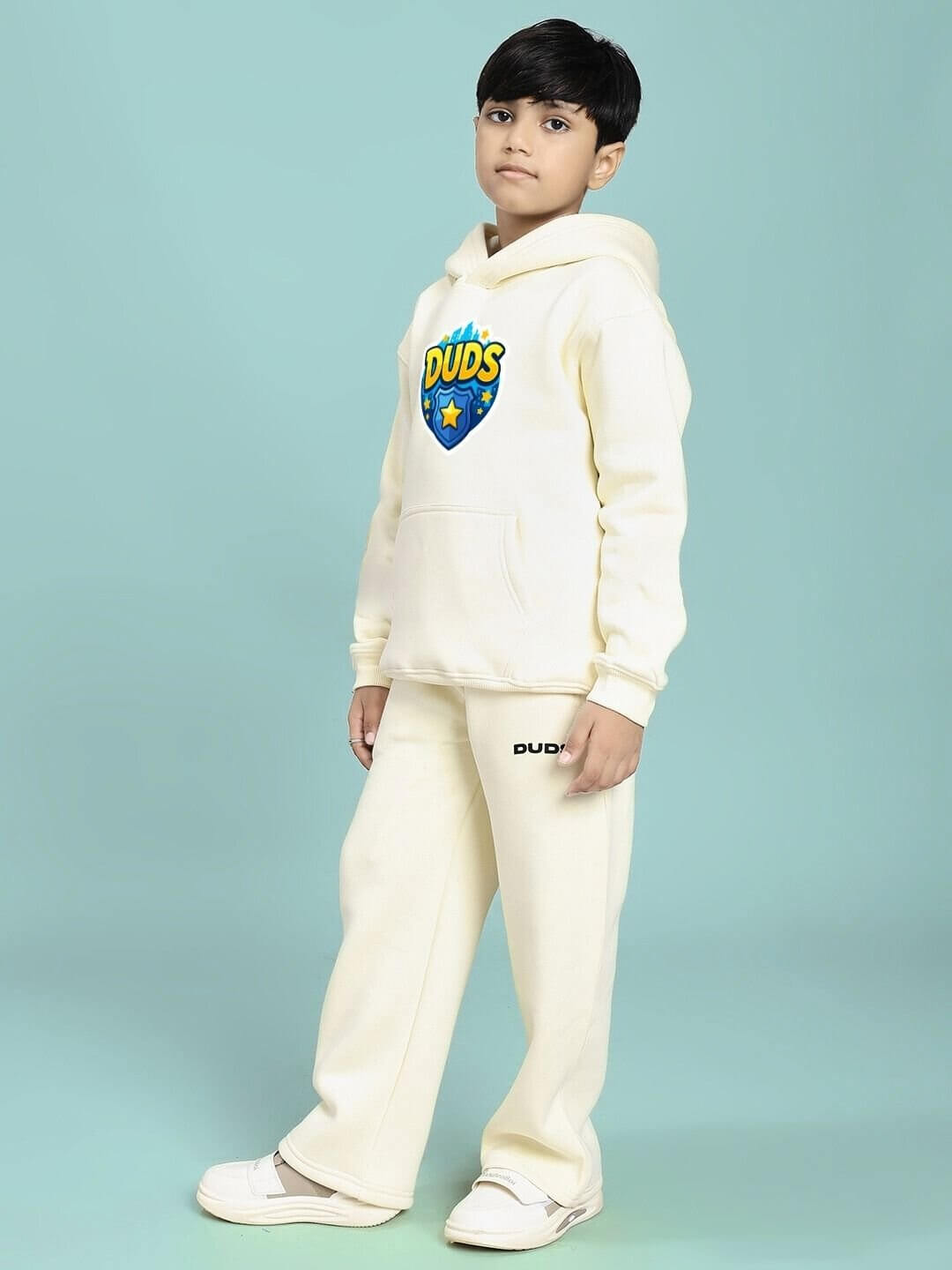 ZOOTOPIA WORLD FLEECE CO-ORD FOR BOYS AND GIRLS OFF WHITE set modeled by a child, featuring a cozy matching hoodie and pants.